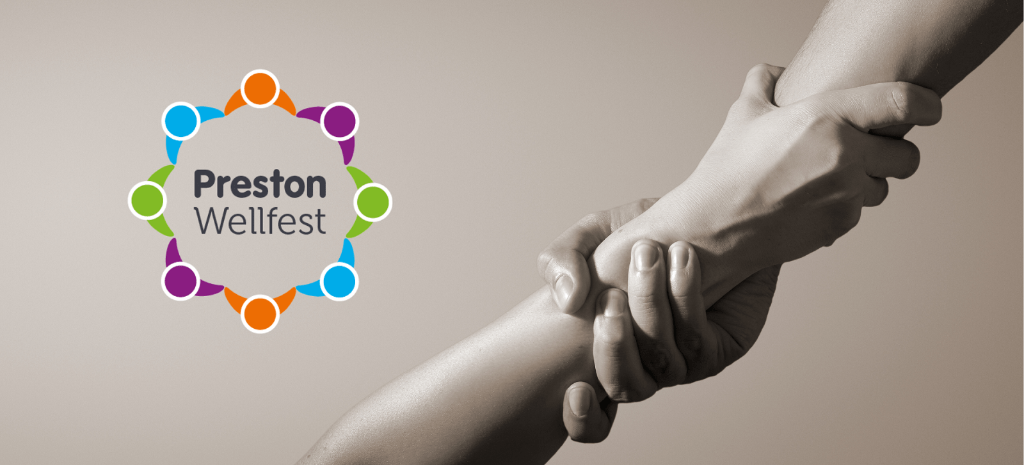 World Suicide Prevention Day Hands interlocked together with the Wellfest Logo