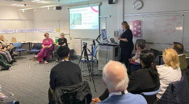 A group of people in a presentation around climate change.