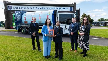 Danikah in front of the Rotopress and staff members of Preston City Council and Archbishop Temple High School