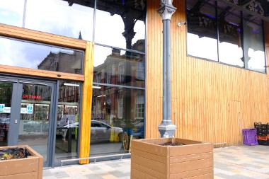 A view of the outside of the Earl Street entrance next to the S5/6 market stall