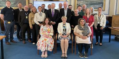 A group of people who are on Preston's Anchor Board, posing for a picture.