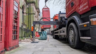 Telephone box being lifted 