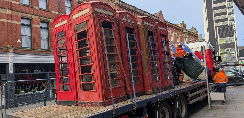 Telephone box being lifted 