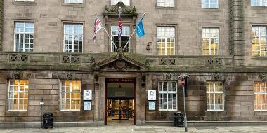 Front of the Town Hall with the Forces Flag raised