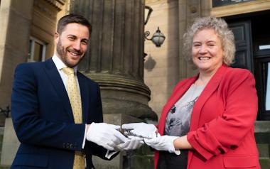 Michael Conlon, Chairman of Conlon Construction handing over The Harris ceremonial key to Councillor Anna Hindle, Cabinet Member for Culture and Arts at Preston City Council