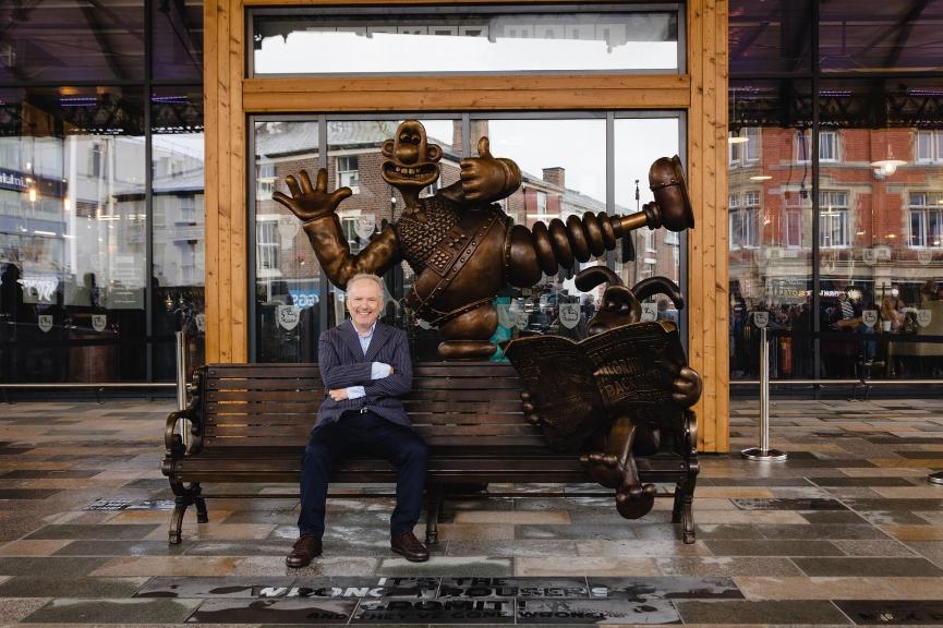 Nick Park at Preston Market's Wallace and Gromit bench in September 2021.